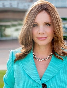 Teresa Knox in teal suit