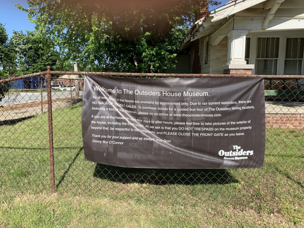 Sign in front of Outsiders House