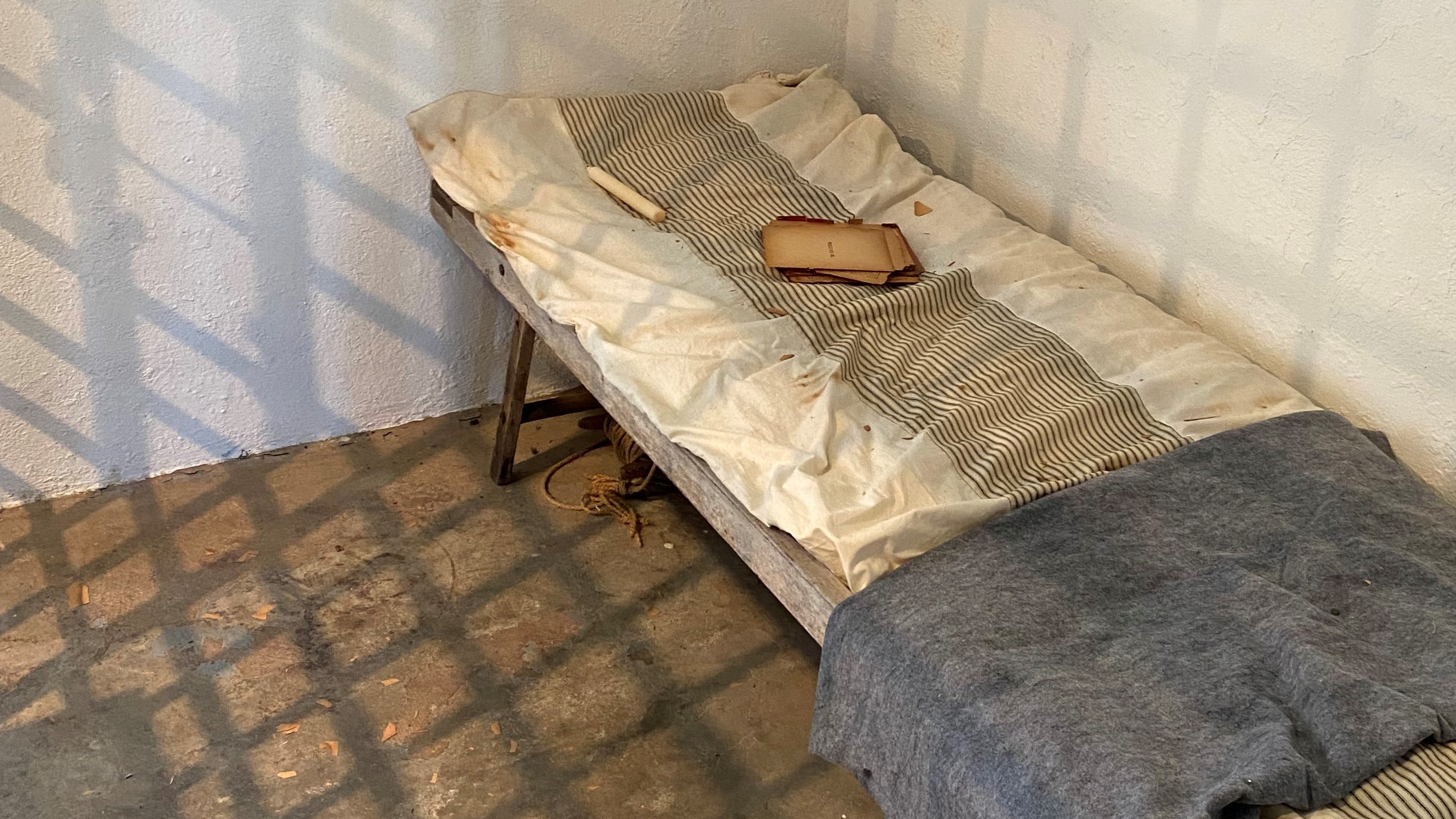 Cot in a prison cell