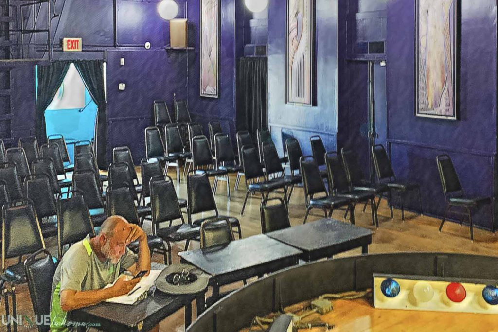 Man working at a desk in the audience chamber