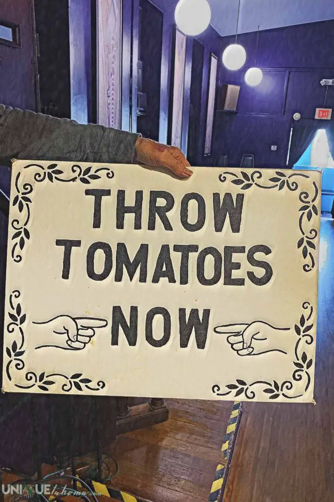 Sign that reads, "Throw Tomatoes Now"